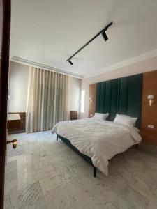 Postel nebo postele na pokoji v ubytování appart hotel lac 2 Tunis
