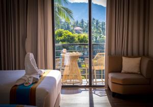 a hotel room with a view of a balcony at Magarra Hotel in Orani