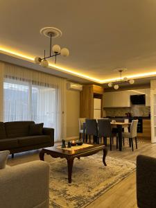 a living room with a couch and a table at My Trabzon trend house in Trabzon