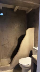 a bathroom with a toilet and a sink at Houses of chora in Serifos Chora