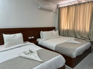 Cama o camas de una habitación en Prince Of Pyramids View Inn