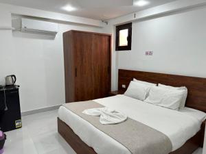 Cama o camas de una habitación en Prince Of Pyramids View Inn