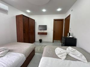 Cama o camas de una habitación en Prince Of Pyramids View Inn