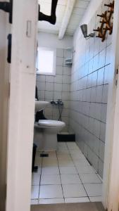 a bathroom with a toilet and a sink at Houses of chora in Serifos Chora