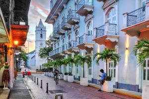 a street in a city with a clock tower at Hotel Caracas - Casco Viejo in Panama City