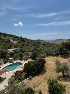 a view of a swimming pool in a resort at Skiathos Country Studios in Skiathos Town