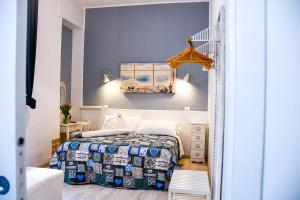 a small bedroom with a bed and a staircase at Le Stanze del Centro in Termoli