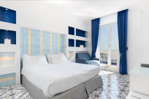 Postel nebo postele na pokoji v ubytování Hotel Bougainville