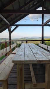 a wooden table sitting on top of a wooden deck at Góralski domek na szczycie in Zwardoń
