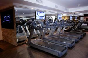 a row of treadmills in a gym at Hotel Reina Isabel in Quito