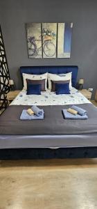 Ένα ή περισσότερα κρεβάτια σε δωμάτιο στο Apartmani blue i green