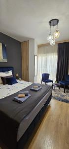 Ένα ή περισσότερα κρεβάτια σε δωμάτιο στο Apartmani blue i green
