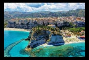 an aerial view of a beach with blue water at Tropea CAPO VATICANO villa - Amphitrite in Capo Vaticano