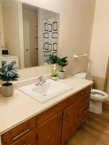 a bathroom with a sink and a toilet at 3 bedrooms home in Kentville