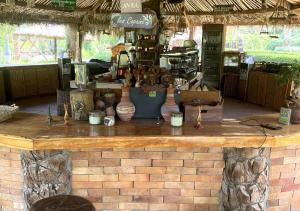 a brick counter with vases on top of it at IL CAMPO Boutique Ecolodge in Cairo