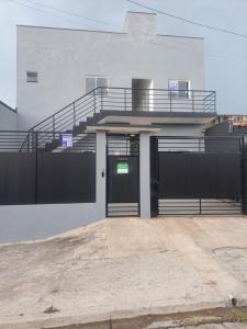 a building with a door and a staircase on it at Pousada do sol in Sorocaba