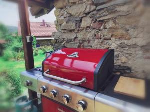 two pieces of luggage sitting on top of a stove at Apartmán Kristian in Ktiš
