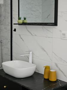 a bathroom with a white bowl sink on a counter at Apartment Mare Paola in Medulin +11 photos