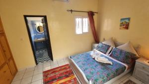 Postel nebo postele na pokoji v ubytování Riad Dar Jules