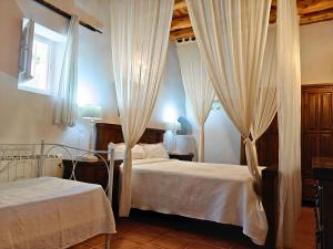 Ένα ή περισσότερα κρεβάτια σε δωμάτιο στο Villa Can Mestreso Suite Ibiza +20 φωτογραφίες