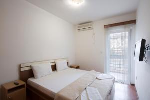 Postel nebo postele na pokoji v ubytování Vila Simon