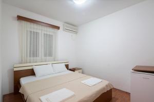 Postel nebo postele na pokoji v ubytování Vila Simon