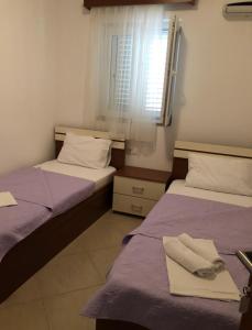 Postel nebo postele na pokoji v ubytování Vila Simon