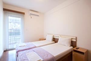 Postel nebo postele na pokoji v ubytování Vila Simon
