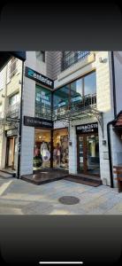 a store front of a building on a city street at Jacuzzi In Bedroom Elegance Apartments in Zlatibor