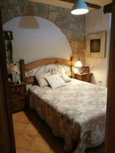 a bedroom with a large bed in a room at La Huerta in Alcañiz +25 photos
