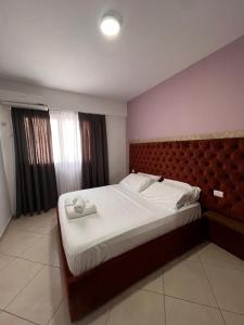 Postel nebo postele na pokoji v ubytování Apartamente Antoni Shengjin