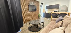 a living room with a couch and a table at Tiberias Suite 411 in Tiberias