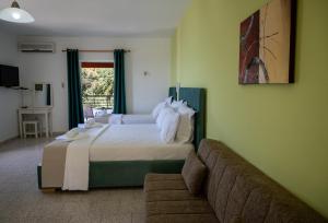 Posteľ alebo postele v izbe v ubytovaní Crystal Blue Hotel, Barbati