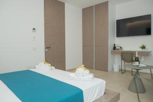 Voodi või voodid majutusasutuse Il Faraglione - Suite di Charme toas
