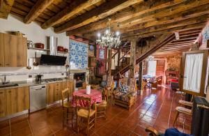 a kitchen with a table and a dining room at Casa catitas in Tagarabuena