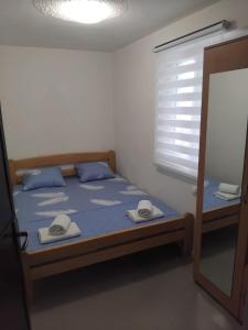 Postel nebo postele na pokoji v ubytování Apartments Vuk&Jovan