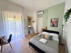 a bedroom with a bed and a desk in it at Quattro Venti city suites in Rome