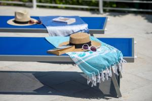 a hat and sunglasses sitting on a table at La Casa di Bruno in Positano +16 photos