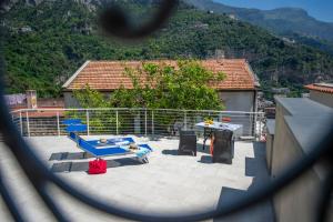 a view from a window of a patio with a table and chairs at La Casa di Bruno in Positano