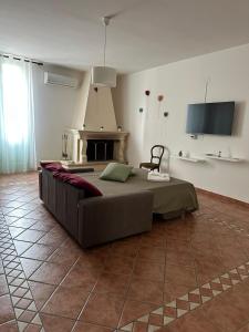 a bedroom with a bed in a room with a fireplace at Palazzo dei Pavoni in Brindisi