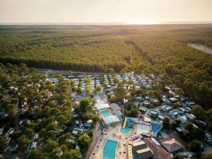 an aerial view of a small village with a resort at CAMPING Les EMBRUNS - 4 ETOILES in Lège-Cap-Ferret