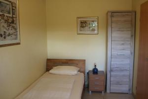 Postel nebo postele na pokoji v ubytování Comfort Apartments SNF zertifiziert - Annemarie Mantke
