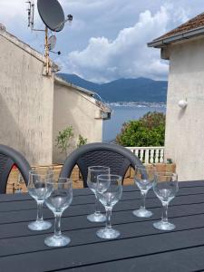 a group of wine glasses sitting on a table at Kotor Bay Villa in Tivat