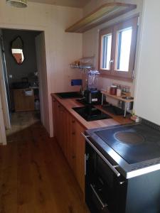 a kitchen with a stove and a counter top at Villa Mara in Perchtoldsdorf +24 photos