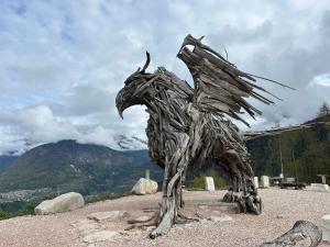 a statue of a horse on top of a mountain at Appartamento Castello Tesino in Castello Tesino