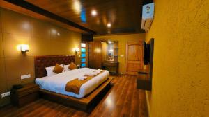 Postelja oz. postelje v sobi nastanitve Vista Resort - Centrally Heated & Air Cooled Near Mall road Manali