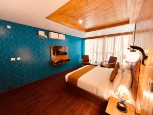 Postelja oz. postelje v sobi nastanitve Vista Resort - Centrally Heated & Air Cooled Near Mall road Manali