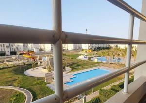 a view of a swimming pool from a building at شاليه إطلالة مميزة in El Alamein
