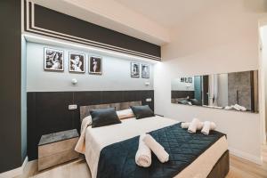 a bedroom with a large bed and a mirror at Monteverde Vatican in Rome