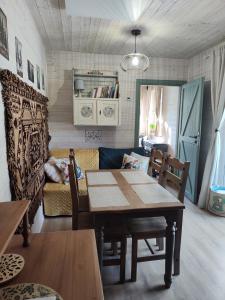 a living room with a table and a couch at Oddech in Miłków +17 photos